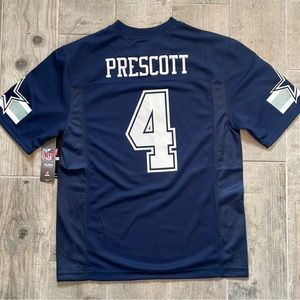 Never been worn with tags on Dak Prescott jersey. Boys large.
